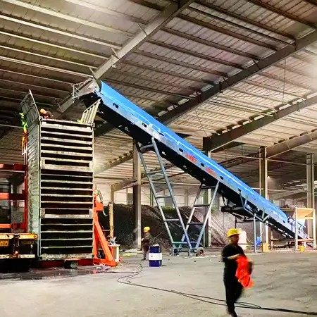 ZFITA container tilter working with belt conveyor for coal loading